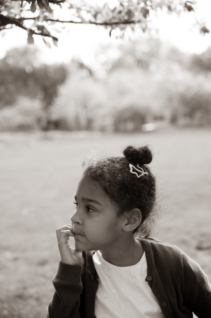 Young girl sitting in the park